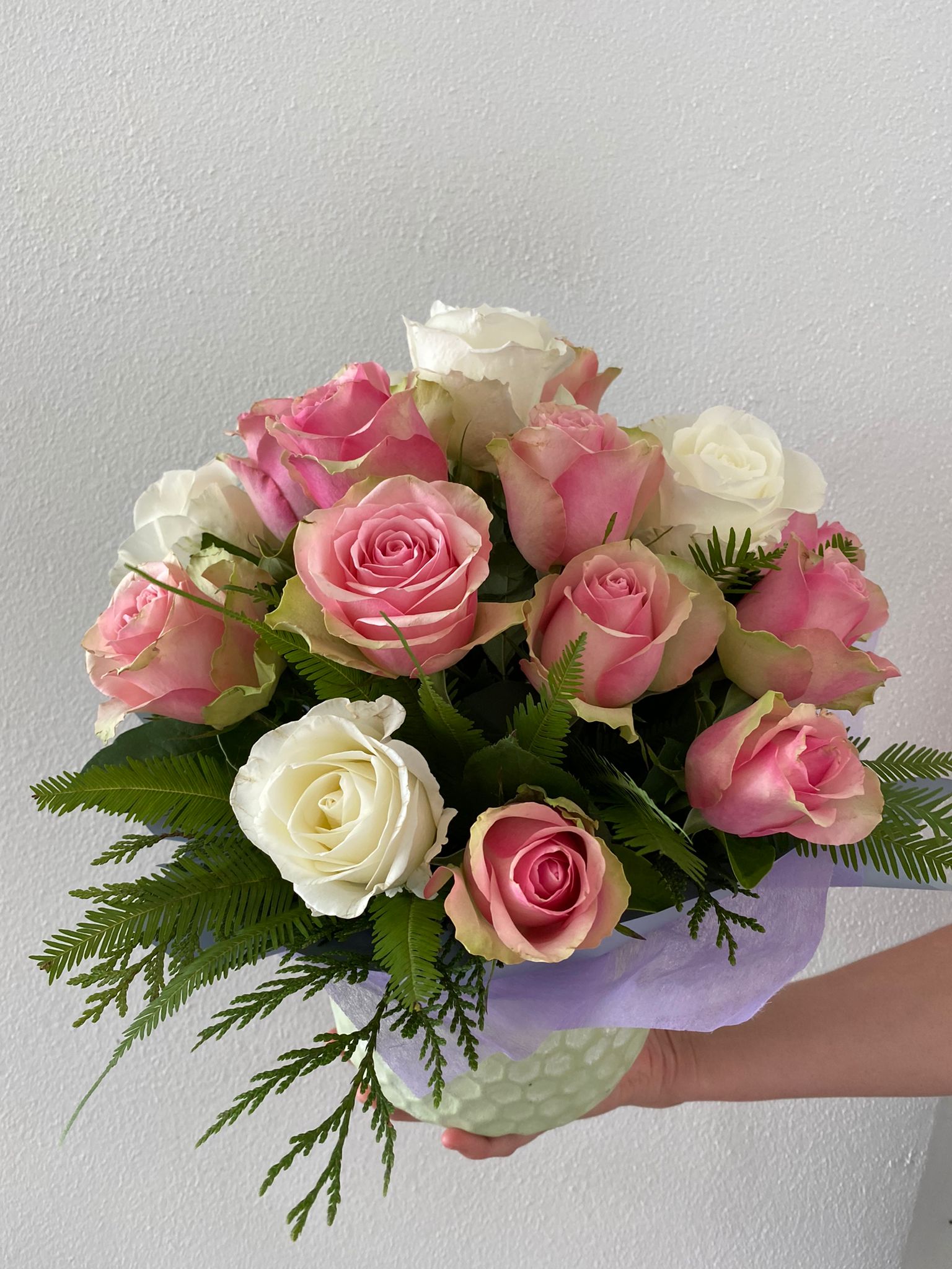 Pastel tone roses in a keepsake ceramic pot